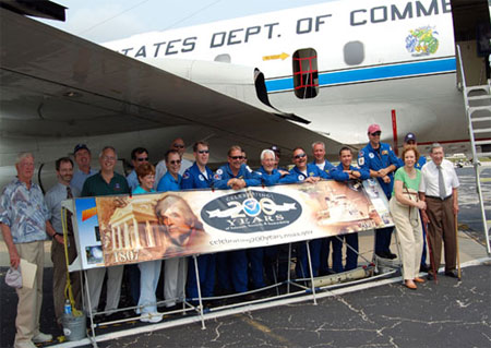 Crew members of NOAA's WP-3D Orion Hurricane Hunter Aircraft join members of the Weather Forecast Office Melbourne