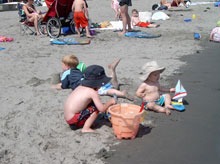 Children enjoying a beach in Rhode Island.