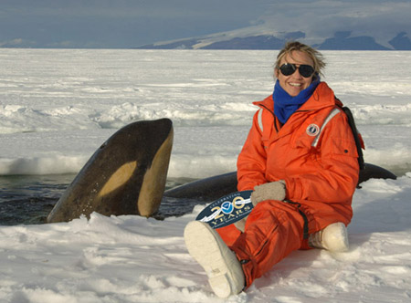 NOAA marine ecologist Lisa Ballance in Antarctica with a killer whale