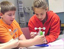 Children learn how to assemble a weather station.