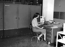 NWRC programmer Irma Lewis at the console of the ALWAC III computer in 1959. 