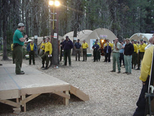 A weather  briefing at fire camp.