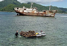 volunteers on a longline fishing vessel transplanting coral