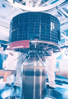 The TIROS  1 satellite mated to a rocket for launching.
