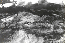 Image shows the 1946 tsunami inundating Hilo, Hawaii.