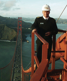 An officer finishes installing a global positioning system receiver on the Golden Gate Bridge.