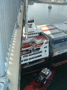 ship going under bridge