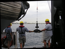 Scientists deploying a Shipek Sediment Sampler from the Nancy Foster during a recent FACE cruise.