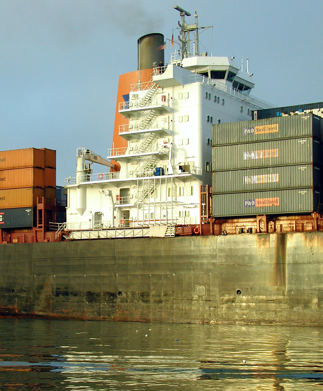 Stacks of cargo containers on the deck of a containership
